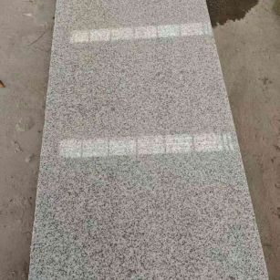 佳木斯芝麻白光面毛板